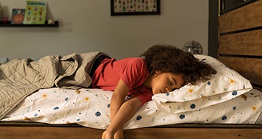 Child sleeping in bed