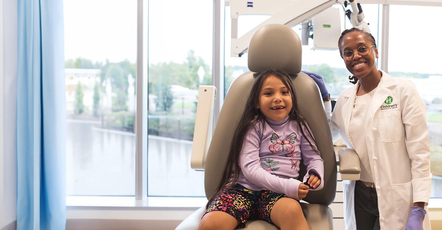 Dr. Clarice Brown examining hispanic girl’s ear in Children’s ENT clinic