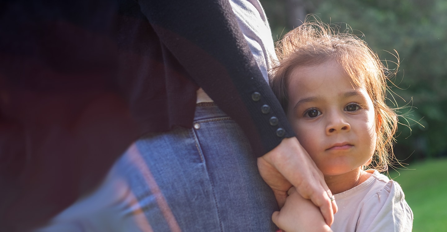 Girl holding mother's hand