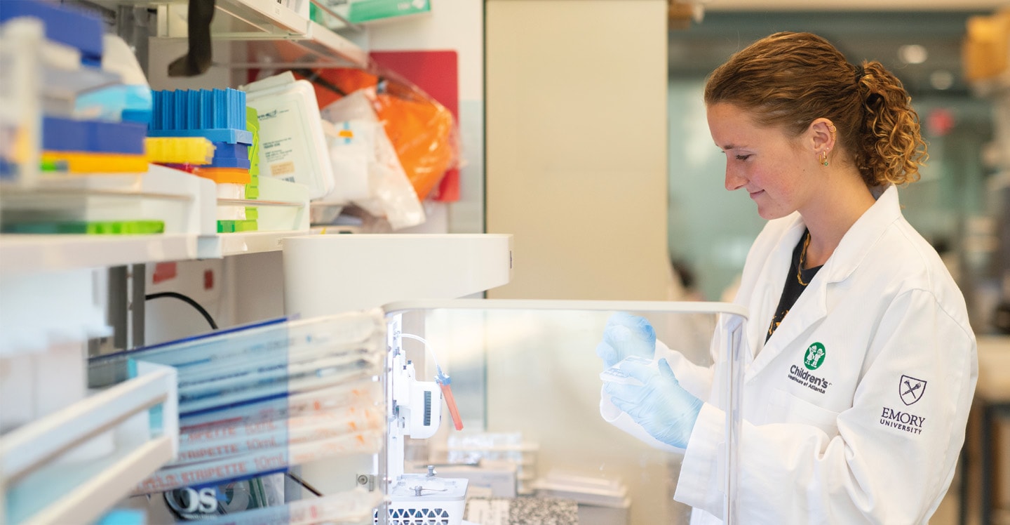 Researcher in the lab smiling