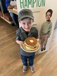 child with pancakes