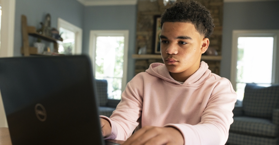 Teenage boy on computer