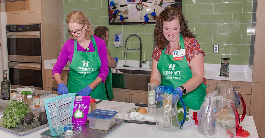 Nurses prepare meal in Children's Teaching Kitchen.