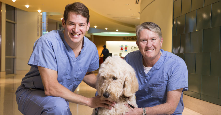 Pediatric orthopedic specialists with therapy dog. 