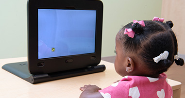 Child in the eye tracking study looking at screen