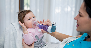 Baby receiving breathing treatment for asthma