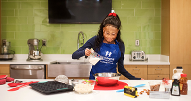 Pediatric sickle cell teen patient learning to cook