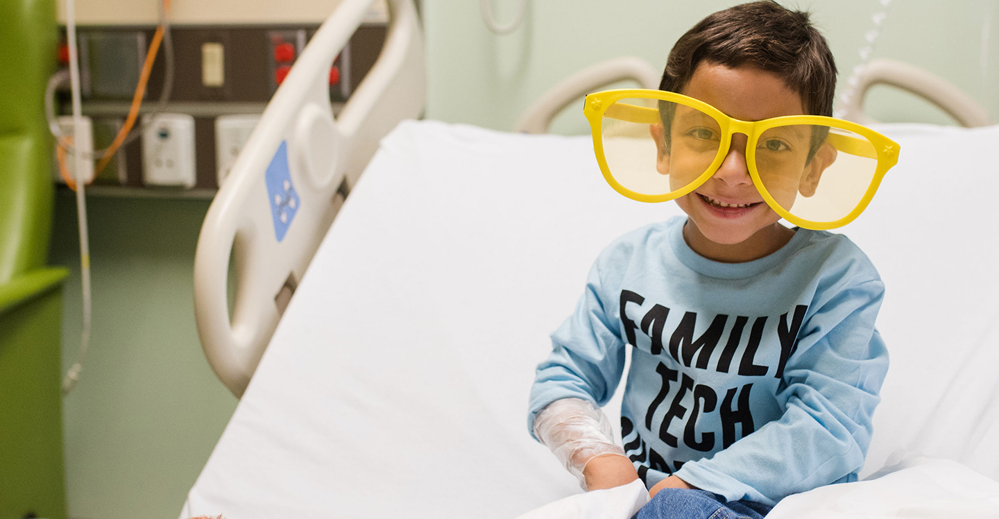 pediatric patient boy wearing silly glasses