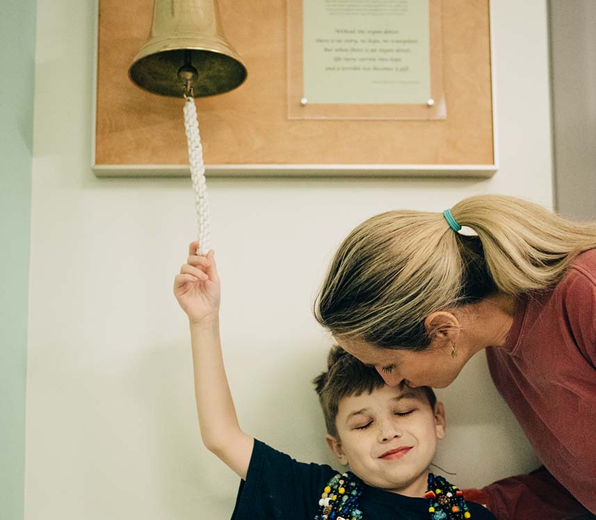 Pediatric cancer patient ringing bell